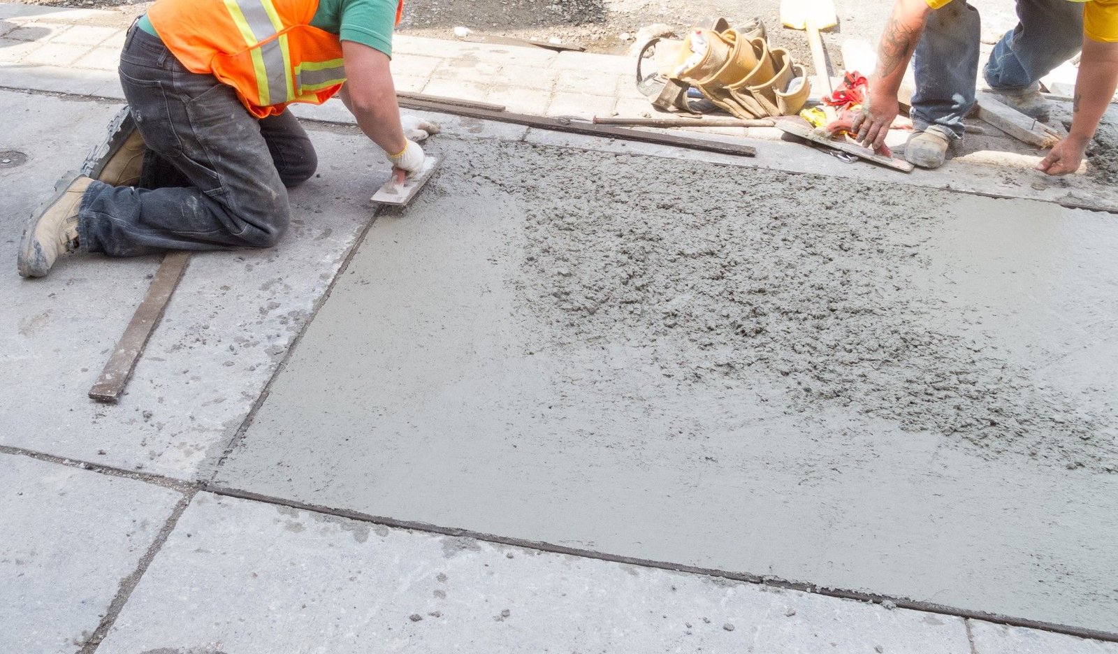 Fresh concrete sidewalk with wood form stakes in Renton WA