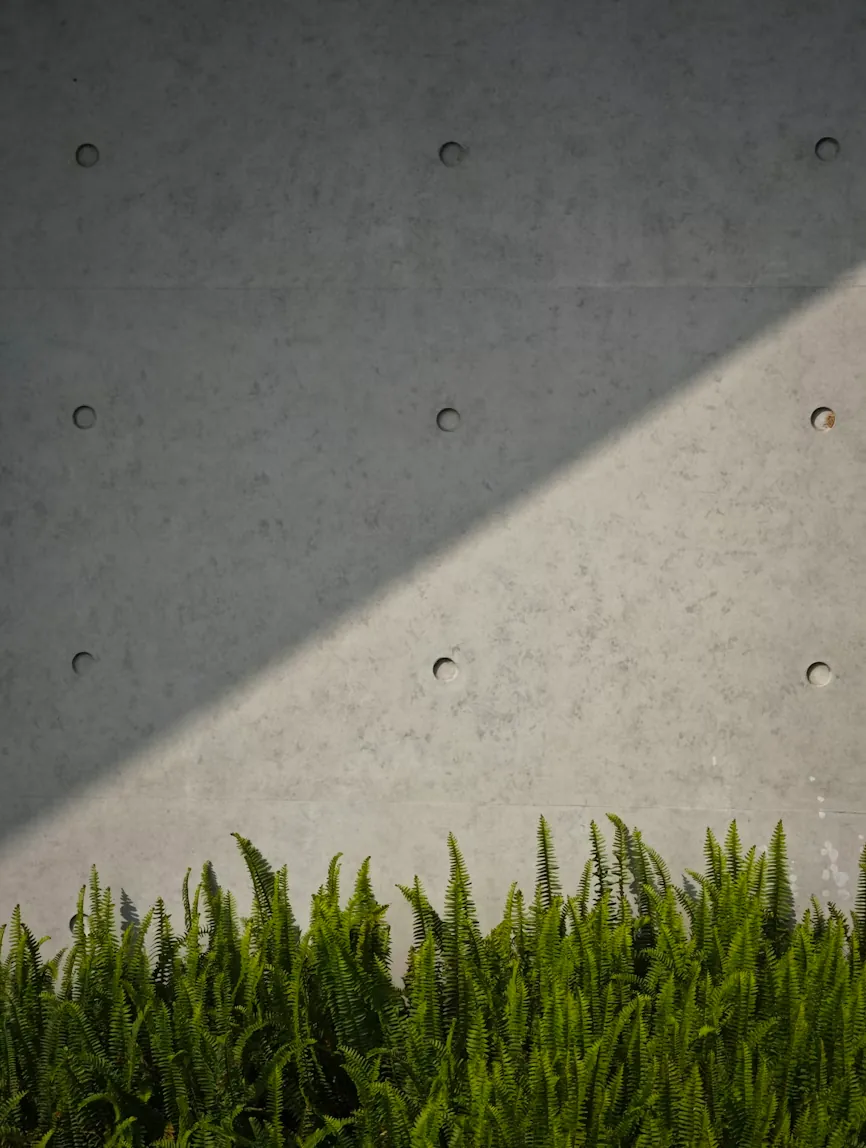 Smooth poured concrete retaining wall with landscaping in Renton WA