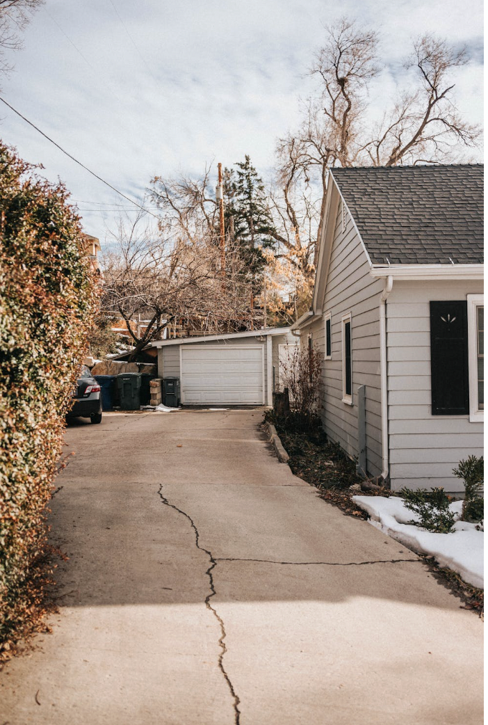 Concrete driveway repair in Renton WA - cracked driveway being repaired